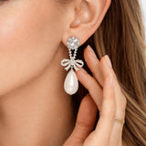 Lynell – Silver Bow Drop Pearl Earrings in White