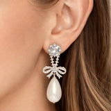 Lynell – Silver Bow Drop Pearl Earrings in White